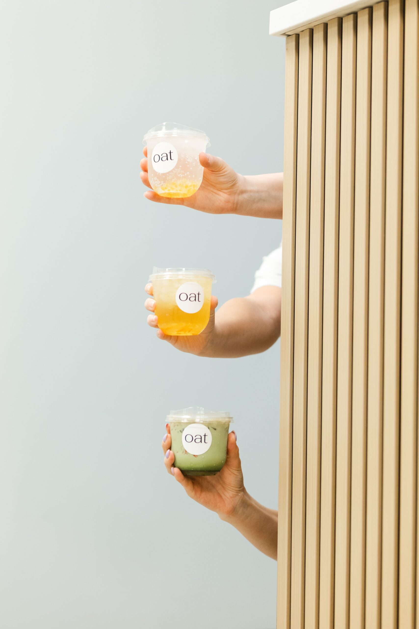 OAT breakfast and coffee bar drinks in hands